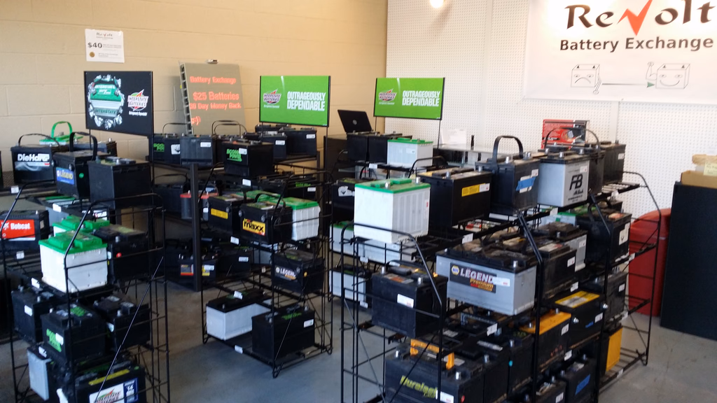 The ReVolt Battery Exchange showroom, with battery brand displays and pricing signage